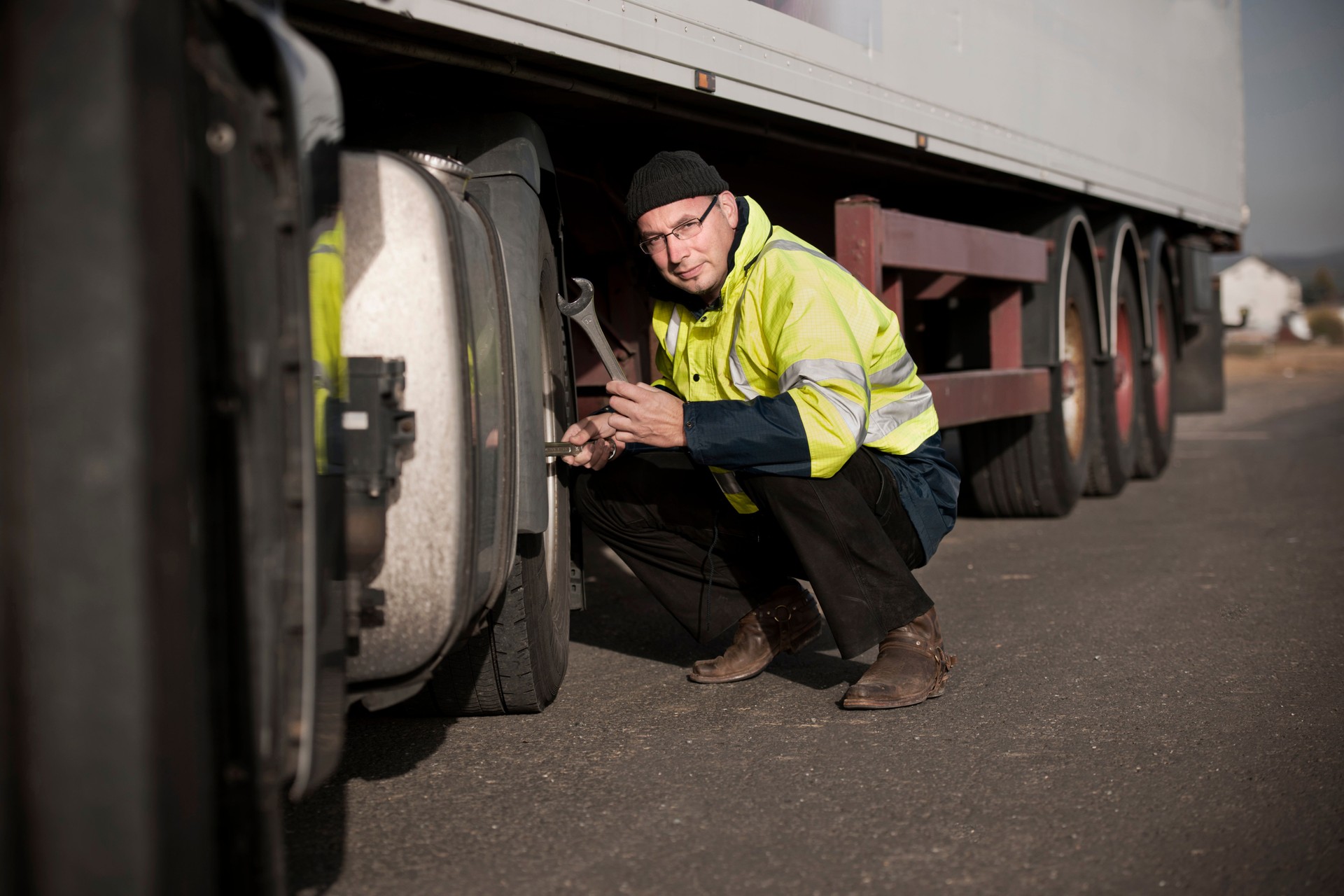 Driver repairing truck